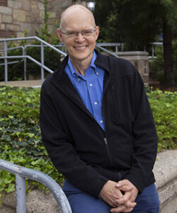 James Bundy in front of University Theatre